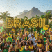 Una animada multitud celebra en Brasil, vestida de amarillo y verde, ondeando banderas y rodeada de confeti. Grandes letras BRASIL iluminadas y palmeras se alzan frente a las montañas en un día soleado.